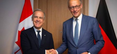 Friedrich Merz and Mark Carney shaking hands